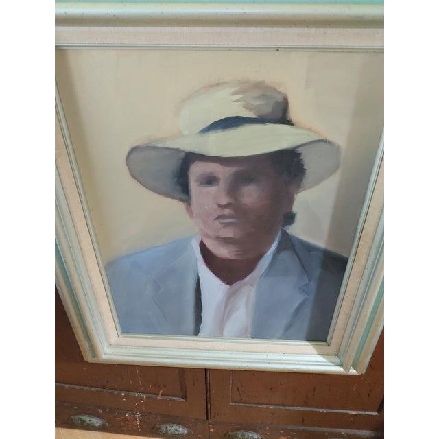 Here's a nicely done portrait circa Mid 20th Century of a young man sporting a hat. This is handsomely framed and would...