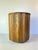 Vintage 1970s mid-century modern oak ice bucket featuring a bold fluted slat design and warm, sculptural form. The...