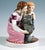 Excellent, rare meissen children group: kneeling girl with long braided hair in a long pink and white dress with elaborate...