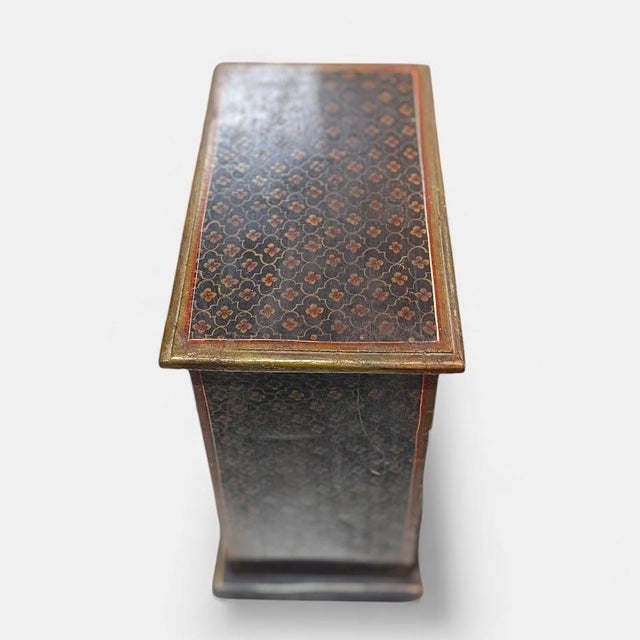 Hand-painted mini chest of drawers produced in the mid-20th century and executed in wood with decorative painted motifs....