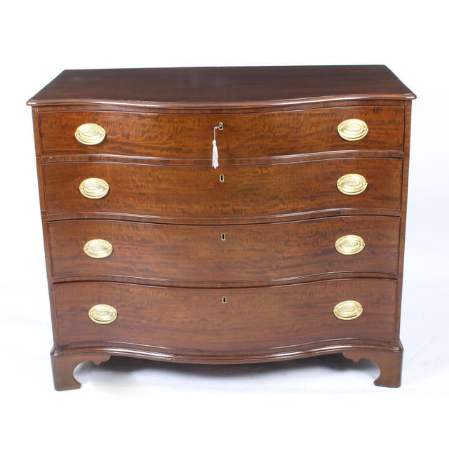 This is beautifully crafted antique george iii flame mahogany serpentine fronted chest of drawers, circa 1780 in date. The...