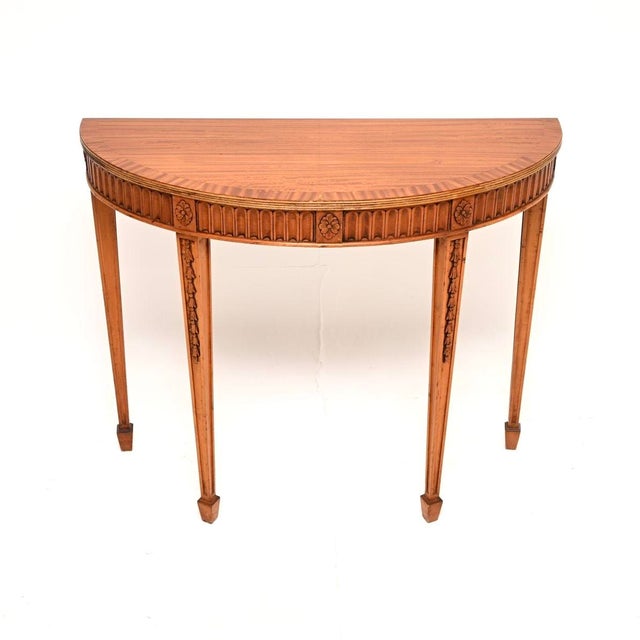 A beautiful antique Georgian style satinwood console table. This was made in England, we would date it to around the...