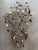 This abstract wall sculpture was created by Curtis Jeré, Artisan House in 2004, as inscribed on the frame. The postmodern...