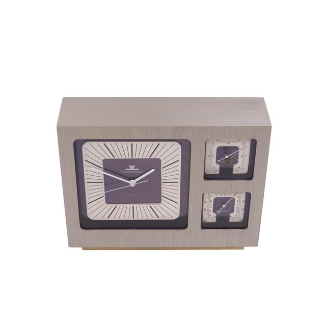 Beautiful Weather station housed in a rectangular brushed steel case with main clock dial mounted on a dark blue ground...