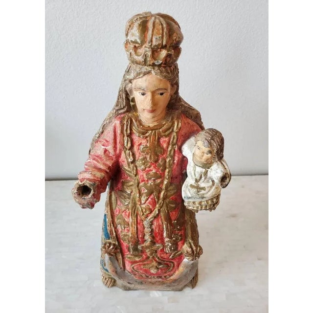 An exceptional example of Spanish Colonial style, born in Mexico in the 19th century, this large hand carved and painted...