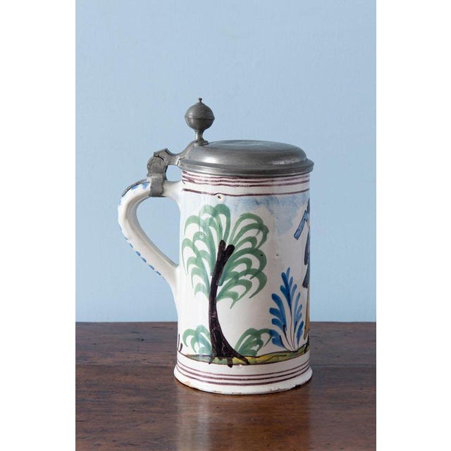 Height: 22 cm Diameter: 15 cm Glaze losses to handle, minor chips to base, minor wear to upper edge (under lid) Marked...