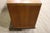Low mid-century modern dresser with six drawers and sculpted ribbon base.