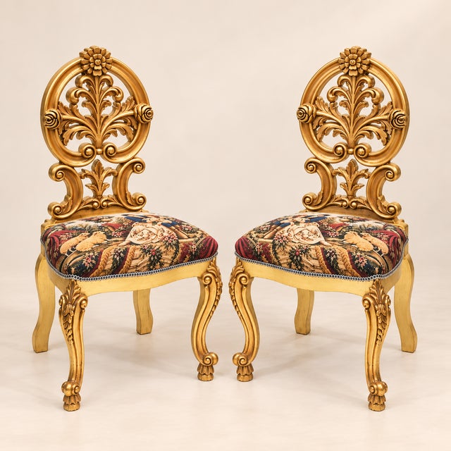 Make a statement with this exquisite set of two French Rococo-inspired accent chairs, featuring intricately sculpted gold...