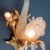 Pair of two-light wall sconces in opalescent glass and gilded bronze. Bundle structure of lake reeds with floral corolla...