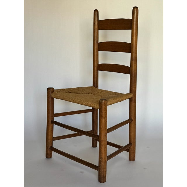 1900s antique ladder back chair with original woven seat. Incredible little side chair.