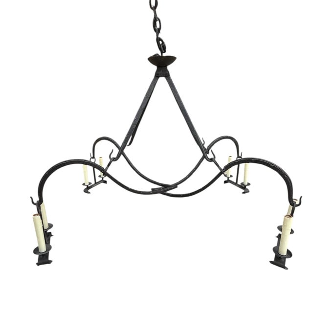 Stunning chandelier from Dennis & Leen, Los Angeles. Spectacular form, substantial yet airy. Two scrolling arms each...