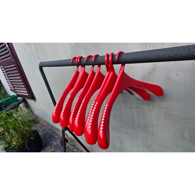 Set of 8 hangers, red, 1990s, Monika Mulder, Swedish, dimensions: height 11.5 cm, width 58.5 cm, depth 11 cm.