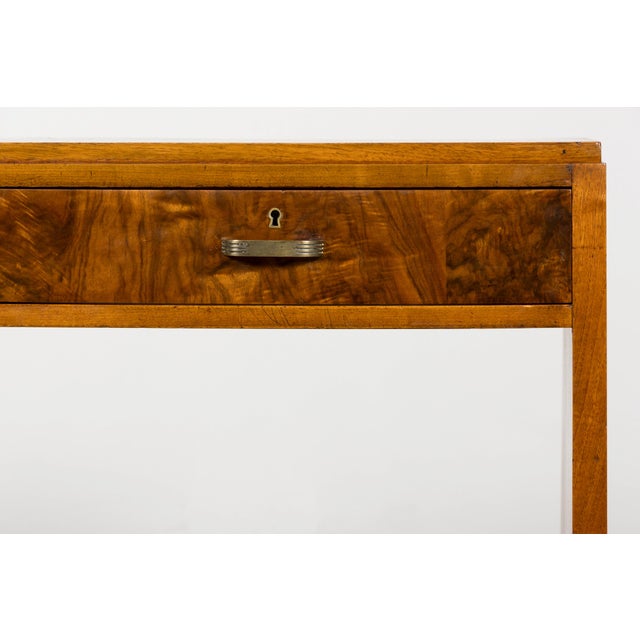1930s and showcases beautifully figured bookmatched walnut veneer throughout. The streamlined architectural form is...