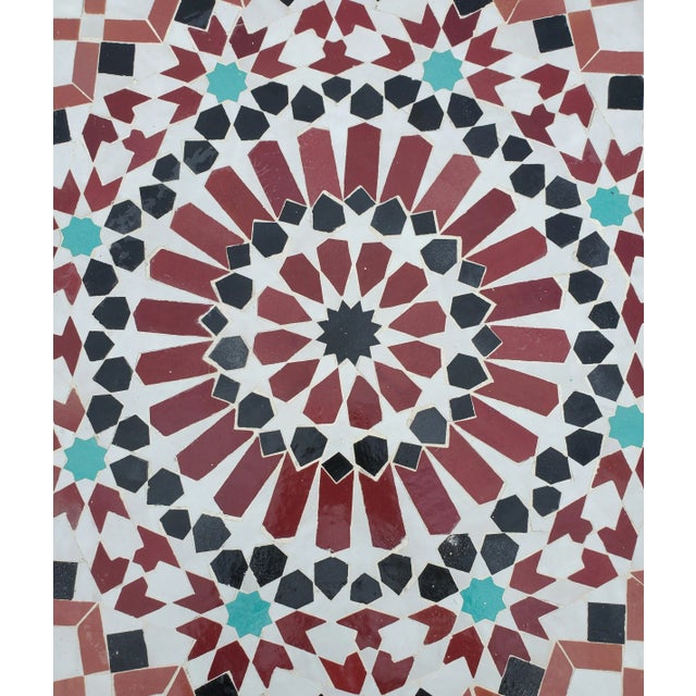Multi-color custom-made Moroccan mosaic table measuring 40" in diameter. An indoor or outdoor dining table that sits two...