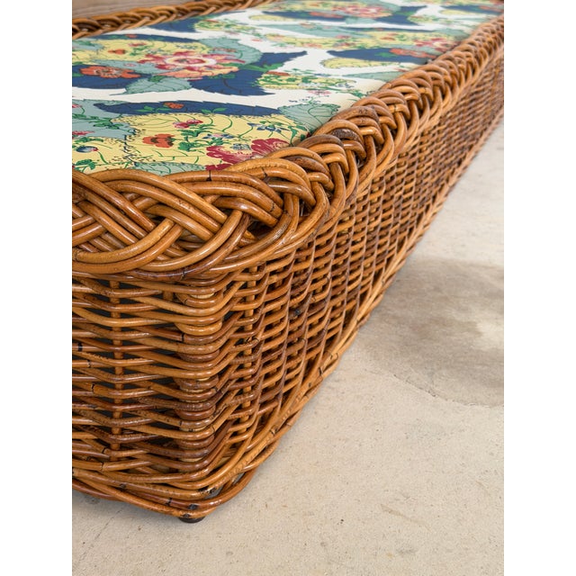 An exceptional vintage rattan and wicker daybed bench designed by Peter Rocchia for The Wicker Works. Measuring an...