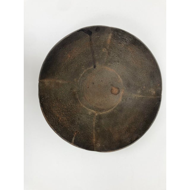 A Vintage hand fashioned Iron Bowl in the Brutalist Style. With good size and weight the Bowl is fashioned from hand-...