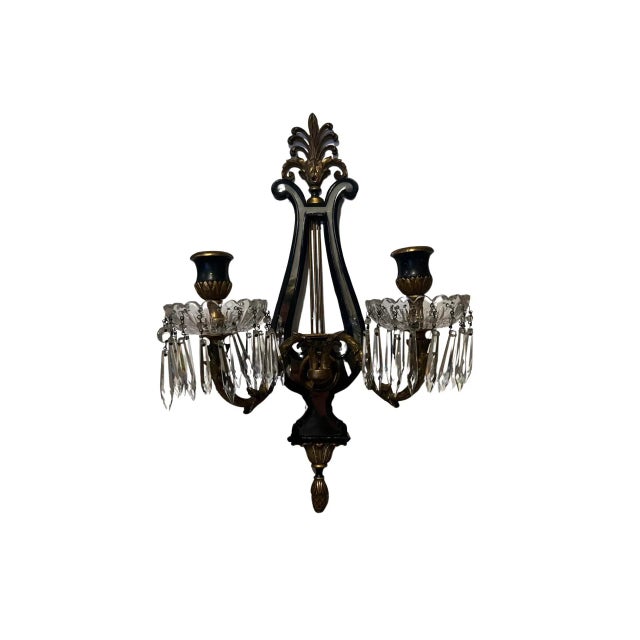 Attributed to E.F. Caldwell A pair of good quality Regency style two-light wall sconces. Each sconce features crystal...