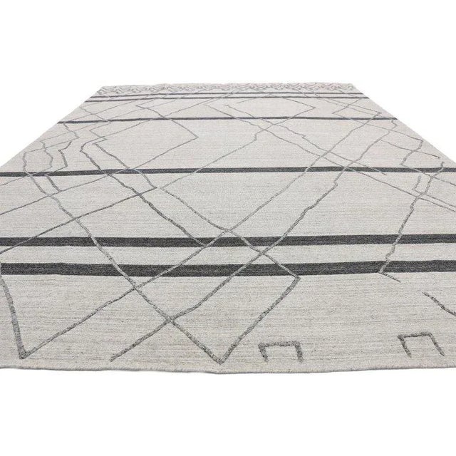 Contemporary gray modern Moroccan style area rug with raised design, textured area rug. Warm hygge vibes meet tribal...