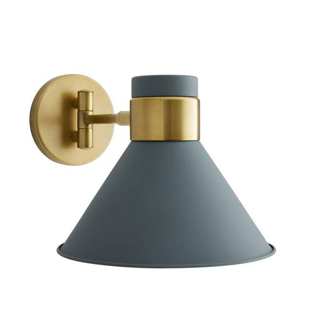 The Lane showcases a schoolhouse-inspired shade that delivers a retro yet modern look. An antique brass steel frame...