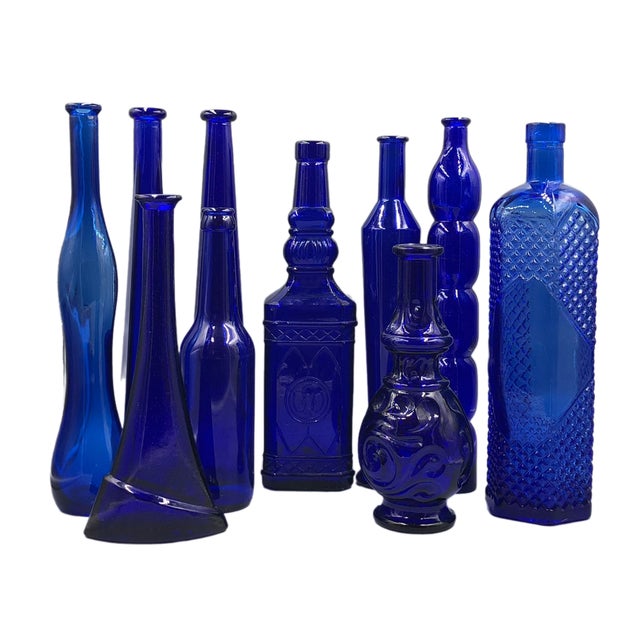 This impressive collection of ten decorative glass bottles in different shades of blue combines elegance and timeless...