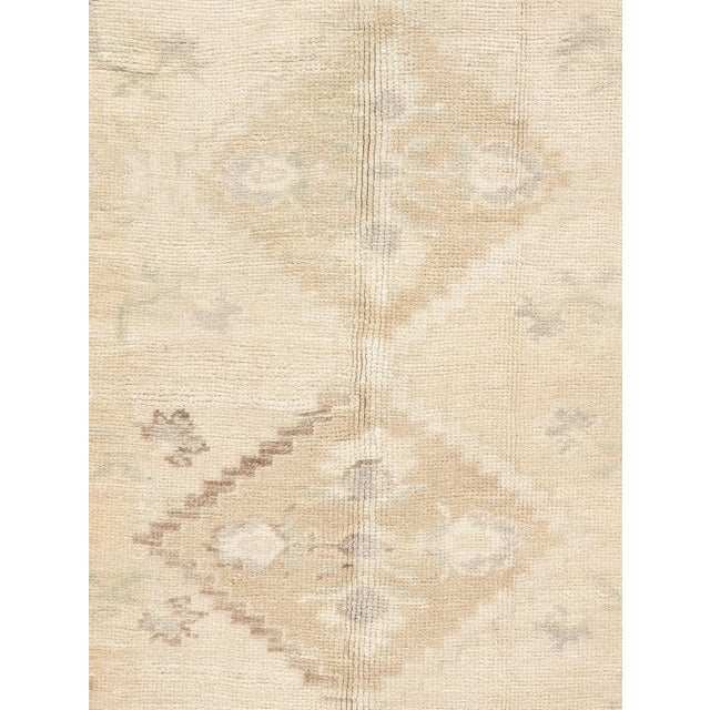 Character, tradition, pattern and palette converge in this gorgeous hand-knotted vintage Turkish Oushak rug with soft...