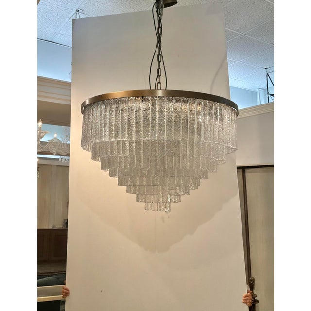 Elegant Baker Kingsley Chandelier. 8 Tiers of Hanging crystal blocks with brass frame. Original Retail $26,997. Showroom...