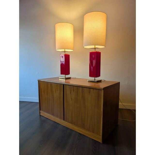 Nice pair of red glazed ceramic & brass table lamps by Kate Spade. Originally purchased at Neiman Marcus. Height 37" Width...
