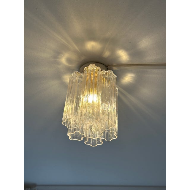 Little bright flush mount with transparent "Tronchi" Murano glass. Metal frame in a bath of gold 24k 1 light, bulb not...