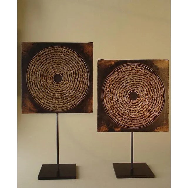 The unusual printing blocks which were used for offset printing depict amuletic designs made up of continuous spiraling...