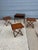 Set includes three folding tables that fold flat and slide into slotted spaces of the occasional Table. Table looks like...