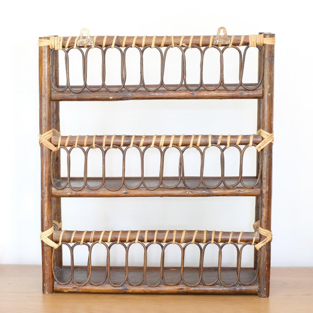 Beautiful rattan/wicker shelf, which can stand along or hung on the wall. These types of shelves are attributed to French...