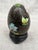 Vintage black floral Chinoiserie cloisonne egg with a separate round wooden stand. No marks. Egg measures 2 5/8" by 1 3/4"...