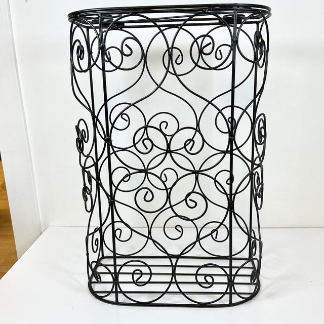 This is a great find. It’s a French style Hamper. Crafted from metal rods curled into an intricate open design. It has a...