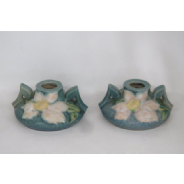 This gorgeous pair of short ceil blue Roseville candlestick holders are made out of ceramic, and are in good condition....