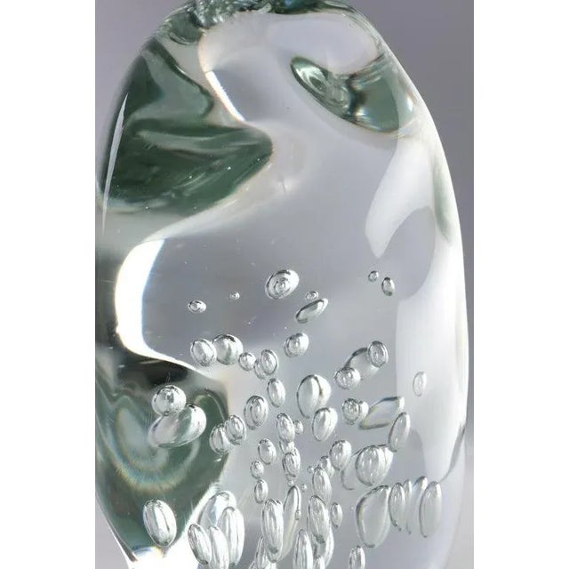 Large amorphic handblown glass sculpture with air bubble inclusions has unique shape from all angles. Beautiful light...