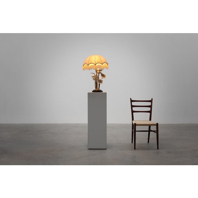 A glamorous and theatrical Hollywood Regency table lamp by Galeotti, crafted in Italy during the 1970s. This striking...
