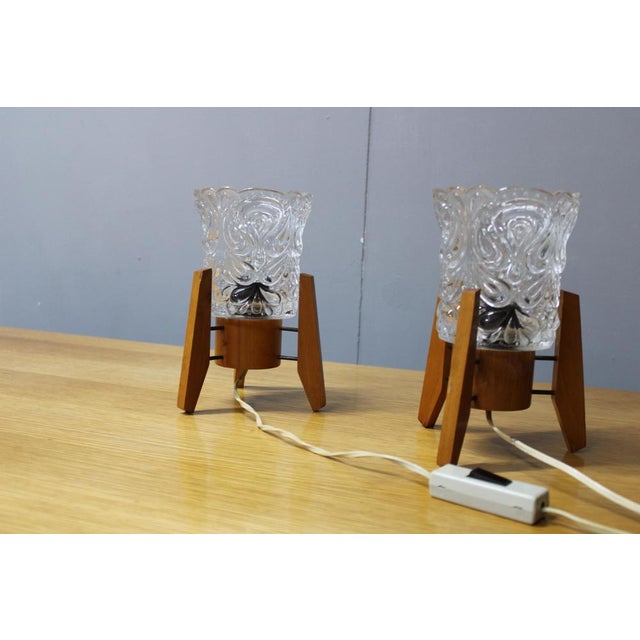 A striking pair of mid-century modern table lamps produced in 1970s czechoslovakia, showcasing a sophisticated combination...