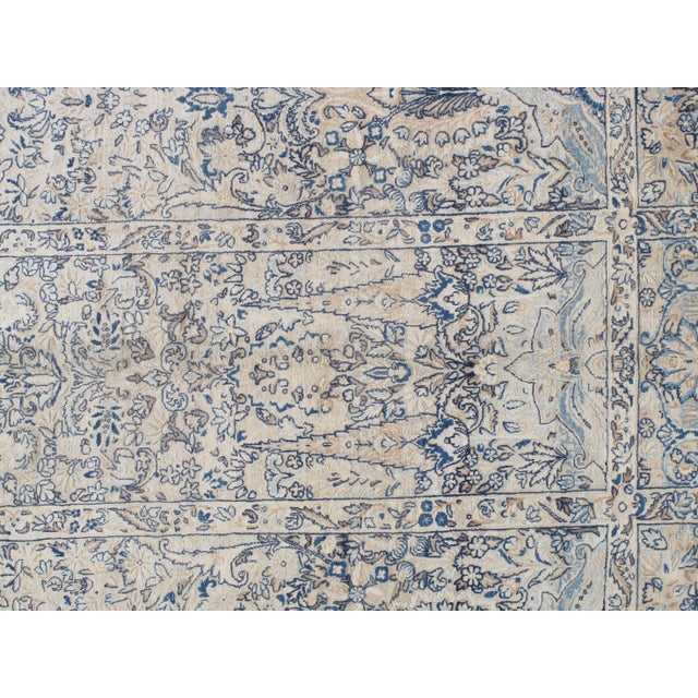 This master crafted Persian Laver Kerman carpet exemplifies the profound understanding of the artistic principles of...