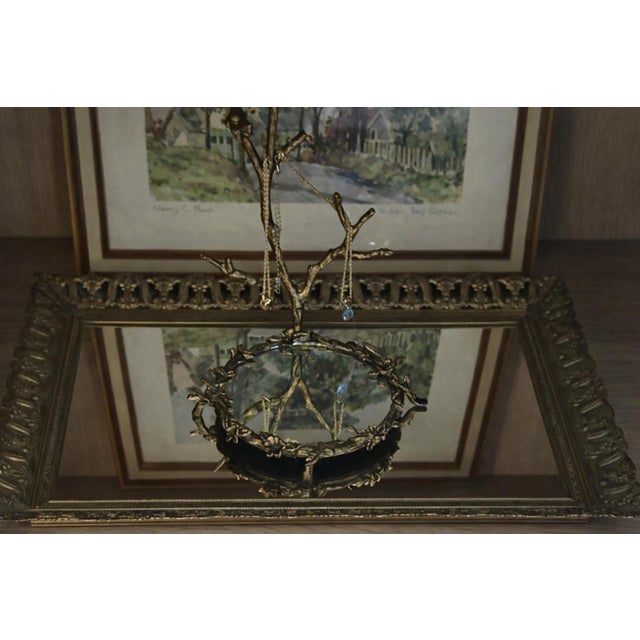 Antique openwork brass vanity mirror tray featuring a neoclassical foliate design. Retains an original aged brass surface...