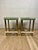 Glamorous pair of vintage Hollywood Regency bar stools dating to the 1970s. Each stool features a polished tubular brass...