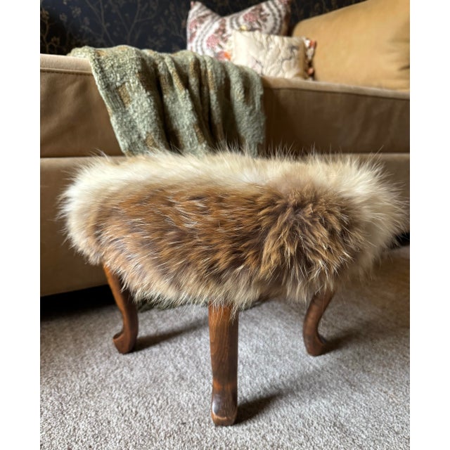 Antique wooden footstool newly upholstered in genuine coyote fur repurposed from a vintage coat. The full, plush fur...