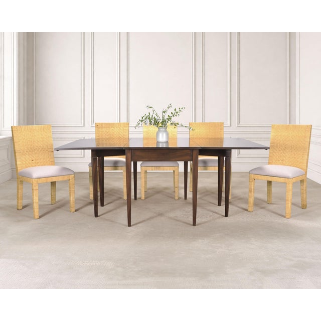 A rare and handsome set of six dining chairs designed by Budji Layug, constructed out of woven vegan leather over a wood...