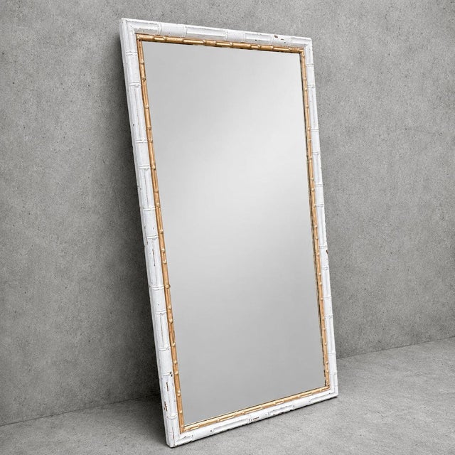 Details * Tall floor or wall mirror * Faux bamboo frame * White painted finish * Gilt inner border * Hollywood Regency...