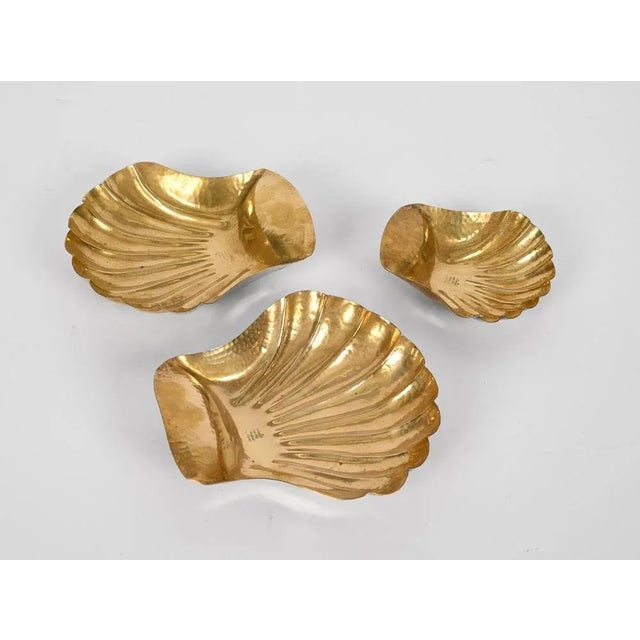 Amazing midcentury set of three shell shaped bowls in solid brass. This delightful piece was designed in Italy during the...