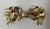 Artfully tied 14k yellow gold pin in the shape of a ribbon. Tests 14k