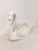 This elegant large vintage white porcelain swan planter and sculpture is a classic and eye-catching decorative piece. The...
