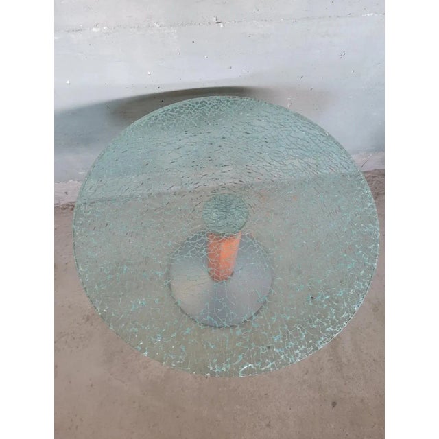 Particular coffee table in glass and wood. with its particular yet simple line, it is suitable for placement in many types...