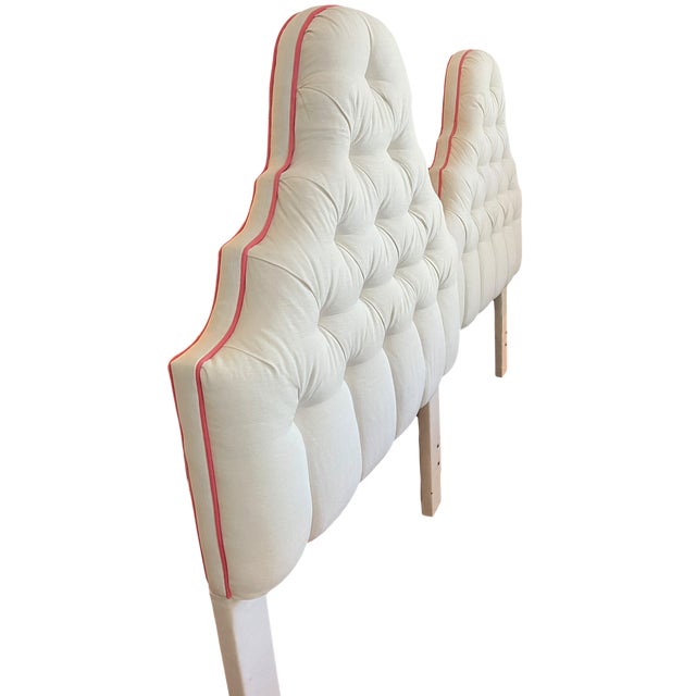 A striking pair of custom upholstered twin headboards featuring a sculptural, scalloped silhouette and plush diamond...