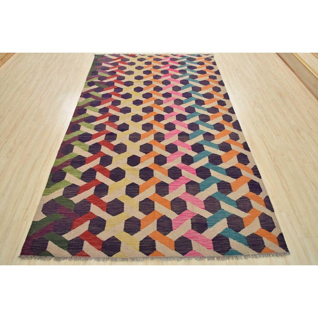 This modern geometric Kilim rug is handwoven with all wool on a wool foundation. This rug is new and in excellent...