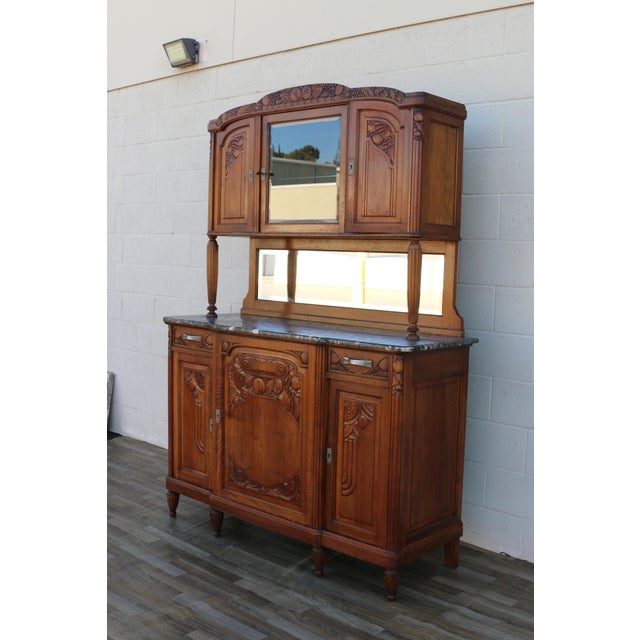 A stunning Antique French Art Deco buffet hutch, dating to the Early 20th Century (circa 1900–1920). Beautifully crafted...